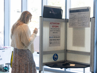 Voters stand in line at a local polling station in Washington, DC, on November 5, 2024. Americans cast their ballots in the presidential rac...