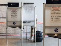 Voters stand in line at a local polling station in Washington, DC, on November 5, 2024. Americans cast their ballots in the presidential rac...