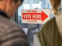 Voters stand in line at a local polling station in Washington, DC, on November 5, 2024. Americans cast their ballots in the presidential rac...