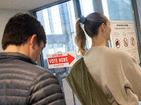 Voters stand in line at a local polling station in Washington, DC, on November 5, 2024. Americans cast their ballots in the presidential rac...