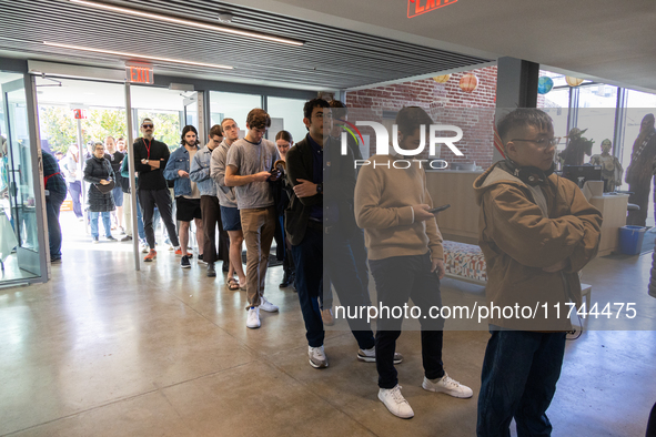 Voters stand in line at a local polling station in Washington, DC, on November 5, 2024. Americans cast their ballots in the presidential rac...