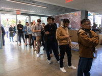 Voters stand in line at a local polling station in Washington, DC, on November 5, 2024. Americans cast their ballots in the presidential rac...