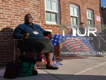 Voters stand in line at a local polling station in Washington, DC, on November 5, 2024. Americans cast their ballots in the presidential rac...