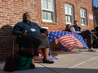 Voters stand in line at a local polling station in Washington, DC, on November 5, 2024. Americans cast their ballots in the presidential rac...