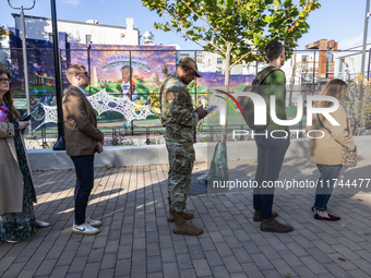 Voters stand in line at a local polling station in Washington, DC, on November 5, 2024. Americans cast their ballots in the presidential rac...