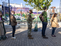 Voters stand in line at a local polling station in Washington, DC, on November 5, 2024. Americans cast their ballots in the presidential rac...