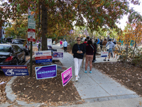 Voters stand in line at a local polling station in Washington, DC, on November 5, 2024. Americans cast their ballots in the presidential rac...