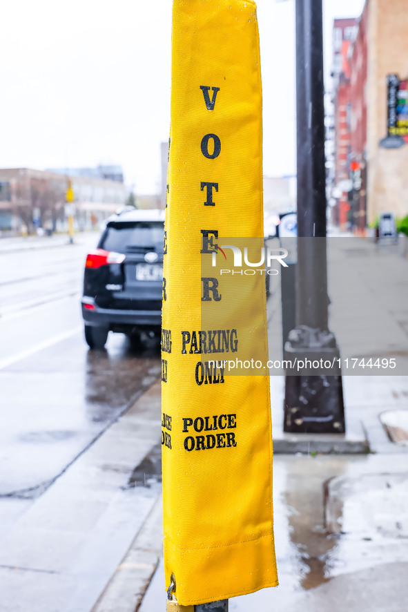 A parking meter cover indicates parking for voters in front of the Minnesota Book Arts Center on Election Day 2024 in Minneapolis, Minnesota...