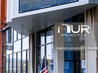 Signs and banners indicate a polling location for voters at the Minnesota Book Arts Center on Election Day 2024 in Minneapolis, Minnesota, o...