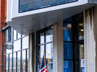 Signs and banners indicate a polling location for voters at the Minnesota Book Arts Center on Election Day 2024 in Minneapolis, Minnesota, o...