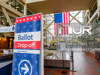 A sign points to a ballot drop-off location within the Hennepin County Government Center on Election Day 2024 in Minneapolis, Minnesota, on...