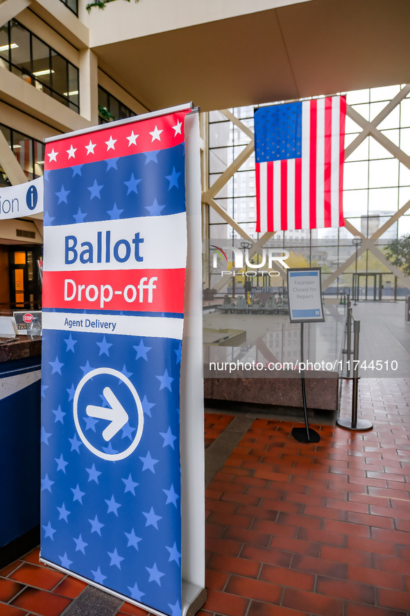 A sign points to a ballot drop-off location within the Hennepin County Government Center on Election Day 2024 in Minneapolis, Minnesota, on...