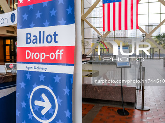 A sign points to a ballot drop-off location within the Hennepin County Government Center on Election Day 2024 in Minneapolis, Minnesota, on...