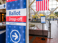 A sign points to a ballot drop-off location within the Hennepin County Government Center on Election Day 2024 in Minneapolis, Minnesota, on...