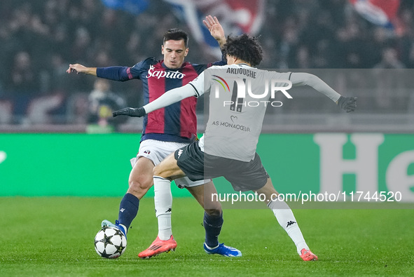 Nikola Moro of Bologna FC and Maghnes Akliouche of AS Monaco compete for the ball during the UEFA Champions League 2024/25 League Phase MD4...