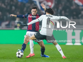 Nikola Moro of Bologna FC and Maghnes Akliouche of AS Monaco compete for the ball during the UEFA Champions League 2024/25 League Phase MD4...