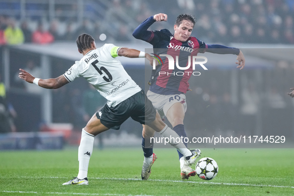 Giovanni Fabbian of Bologna FC and Thilo Kehrer of AS Monaco compete for the ball during the UEFA Champions League 2024/25 League Phase MD4...