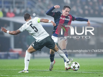 Giovanni Fabbian of Bologna FC and Thilo Kehrer of AS Monaco compete for the ball during the UEFA Champions League 2024/25 League Phase MD4...