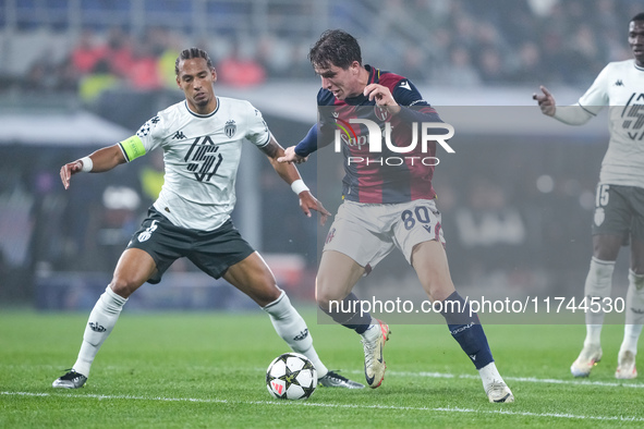 Giovanni Fabbian of Bologna FC and Thilo Kehrer of AS Monaco compete for the ball during the UEFA Champions League 2024/25 League Phase MD4...