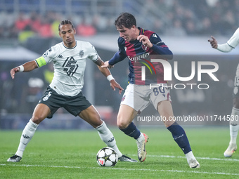 Giovanni Fabbian of Bologna FC and Thilo Kehrer of AS Monaco compete for the ball during the UEFA Champions League 2024/25 League Phase MD4...