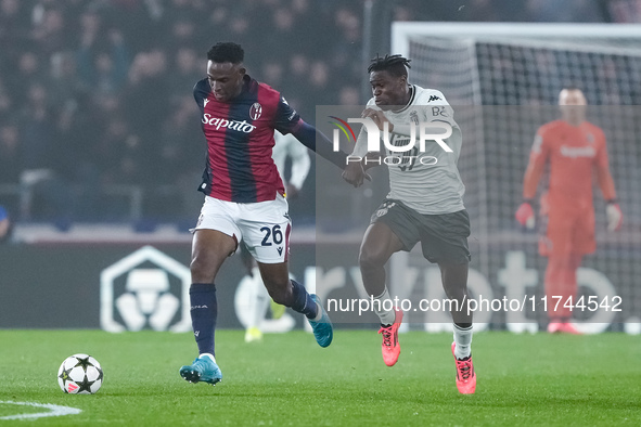 Jhon Lucumi of Bologna FC and Wilfried Singo of AS Monaco compete for the ball during the UEFA Champions League 2024/25 League Phase MD4 mat...