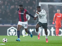 Jhon Lucumi of Bologna FC and Wilfried Singo of AS Monaco compete for the ball during the UEFA Champions League 2024/25 League Phase MD4 mat...