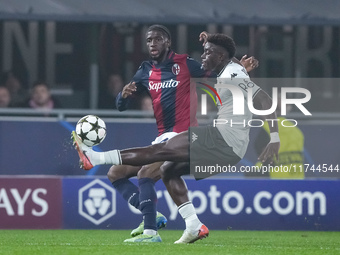 Christian Mawissa of AS Monaco andSamuel Iling-Junior of Bologna FC compete for the ball during the UEFA Champions League 2024/25 League Pha...