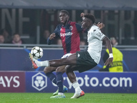 Christian Mawissa of AS Monaco andSamuel Iling-Junior of Bologna FC compete for the ball during the UEFA Champions League 2024/25 League Pha...