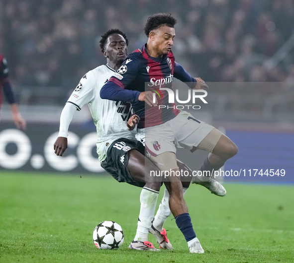 Dan Ndoye of Bologna FC and Soungoutou Magassa of AS Monaco compete for the ball during the UEFA Champions League 2024/25 League Phase MD4 m...