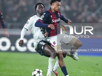 Dan Ndoye of Bologna FC and Soungoutou Magassa of AS Monaco compete for the ball during the UEFA Champions League 2024/25 League Phase MD4 m...