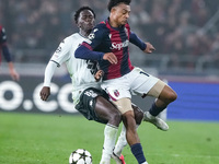 Dan Ndoye of Bologna FC and Soungoutou Magassa of AS Monaco compete for the ball during the UEFA Champions League 2024/25 League Phase MD4 m...