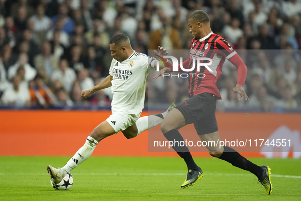 Kylian Mbappe centre-forward of Real Madrid and France shooting to goal front Malick Thiaw centre-back of AC Milan and Germany during the UE...