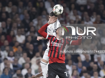 Federico Valverde of Real Madrid and Alvaro Morata of AC Milan fight for the ball during the UEFA Champions League 2024/25 match between Rea...