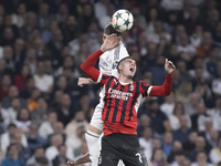 Federico Valverde of Real Madrid and Alvaro Morata of AC Milan fight for the ball during the UEFA Champions League 2024/25 match between Rea...