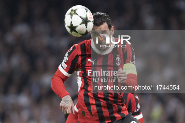 Theo Hernandez of AC Milan is in action during the UEFA Champions League 2024/25 match between Real Madrid and AC Milan at Santiago Bernabeu...