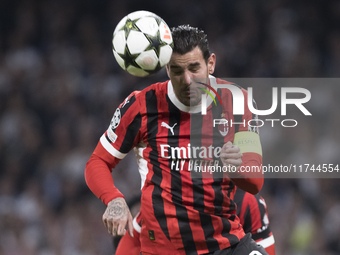 Theo Hernandez of AC Milan is in action during the UEFA Champions League 2024/25 match between Real Madrid and AC Milan at Santiago Bernabeu...