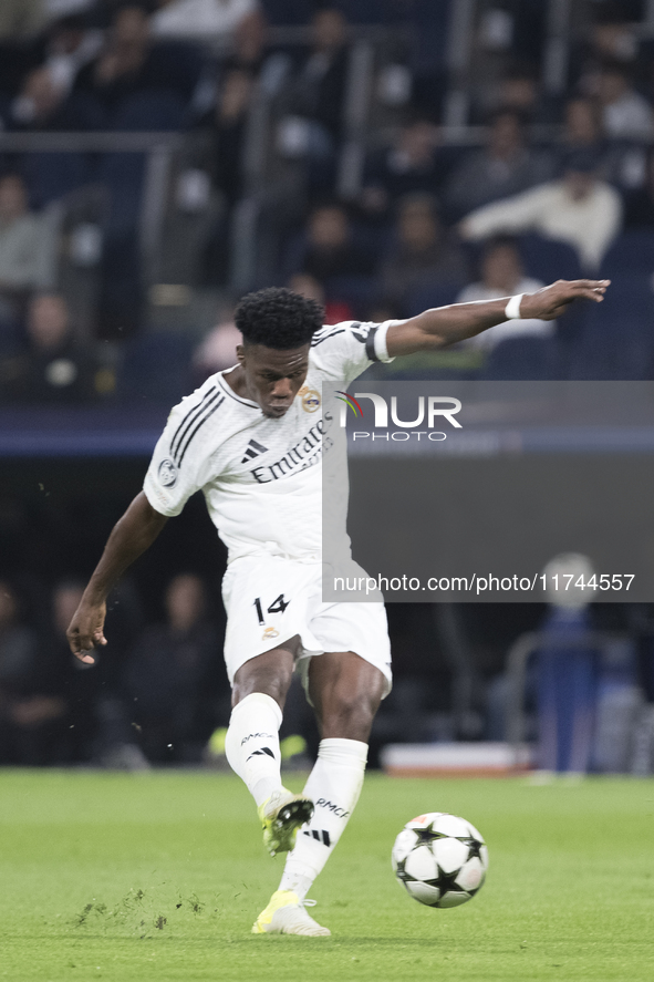 Aurelien Tchouameni of Real Madrid attempts a shot during the UEFA Champions League 2024/25 match between Real Madrid and AC Milan at Santia...