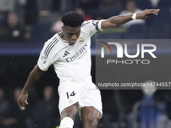 Aurelien Tchouameni of Real Madrid attempts a shot during the UEFA Champions League 2024/25 match between Real Madrid and AC Milan at Santia...