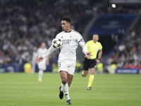 Jude Bellingham of Real Madrid controls the ball during the UEFA Champions League 2024/25 match between Real Madrid and AC Milan at Santiago...