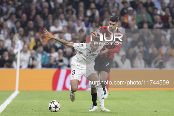 In Madrid, Spain, on November 5, Kylian Mbappe of Real Madrid and Alvaro Morata of AC Milan fight for the ball during the UEFA Champions Lea...