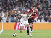 In Madrid, Spain, on November 5, Kylian Mbappe of Real Madrid and Alvaro Morata of AC Milan fight for the ball during the UEFA Champions Lea...