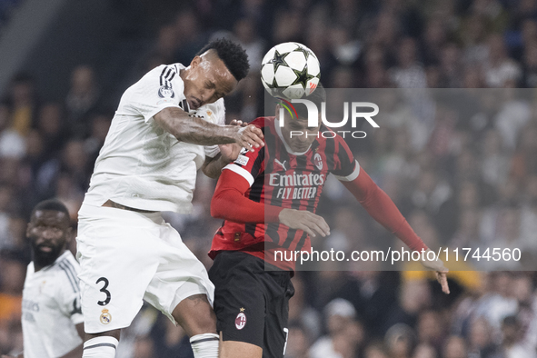 Eder Militao of Real Madrid and Alvaro Morata of AC Milan fight for the ball during the UEFA Champions League 2024/25 match between Real Mad...