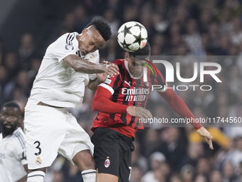 Eder Militao of Real Madrid and Alvaro Morata of AC Milan fight for the ball during the UEFA Champions League 2024/25 match between Real Mad...