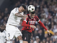 Eder Militao of Real Madrid and Alvaro Morata of AC Milan fight for the ball during the UEFA Champions League 2024/25 match between Real Mad...