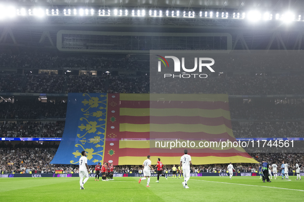 A Valencia flag is displayed at the Santiago Bernabeu Stadium in Madrid, Spain, on November 5, in memory of those who died in the Valencia f...