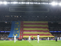 A Valencia flag is displayed at the Santiago Bernabeu Stadium in Madrid, Spain, on November 5, in memory of those who died in the Valencia f...