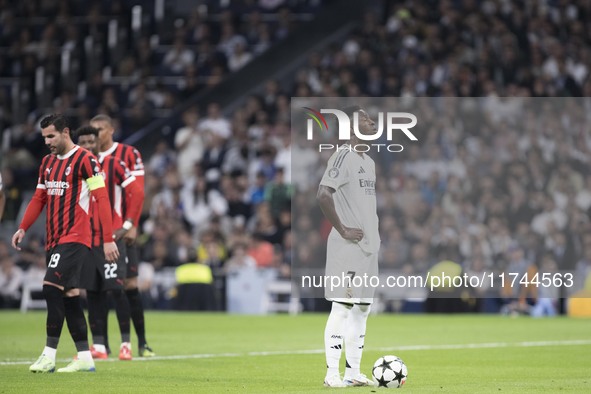 Vinicius Jr of Real Madrid prepares to shoot a penalty during the UEFA Champions League 2024/25 match between Real Madrid and AC Milan at Sa...