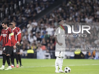 Vinicius Jr of Real Madrid prepares to shoot a penalty during the UEFA Champions League 2024/25 match between Real Madrid and AC Milan at Sa...