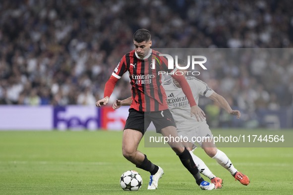 Alvaro Morata of AC Milan is in action during the UEFA Champions League 2024/25 match between Real Madrid and AC Milan at Santiago Bernabeu...