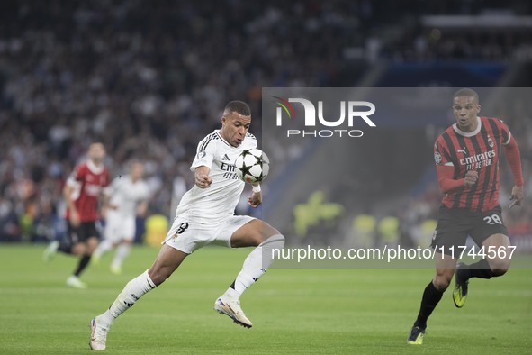 Kylian Mbappe of Real Madrid controls the ball during the UEFA Champions League 2024/25 match between Real Madrid and AC Milan at Santiago B...